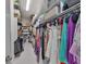 Spacious walk-in closet with custom shelving and ample hanging space for clothes and accessories at 415 Islebay Dr, Apollo Beach, FL 33572