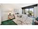 Bright bedroom with water view, featuring a comfortable bed and ample natural light at 50 Coe Rd # 224, Belleair, FL 33756