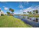 Stunning view of a pond and lush landscaping at 50 Coe Rd # 224, Belleair, FL 33756