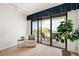 Peaceful sitting area featuring a comfortable chair and a view at 50 Coe Rd # 224, Belleair, FL 33756