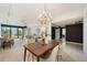 Open concept dining area with living room and water view at 50 Coe Rd # 224, Belleair, FL 33756
