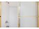 Clean shower with tile surround and sliding glass doors at 50 Coe Rd # 224, Belleair, FL 33756
