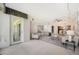 Living room with access to a balcony and an open floor plan at 50 Coe Rd # 224, Belleair, FL 33756