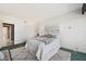 Spacious bedroom with a queen-size bed and access to a bathroom at 50 Coe Rd # 224, Belleair, FL 33756