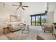 Bright living room with water views, comfortable seating, and large windows at 50 Coe Rd # 224, Belleair, FL 33756