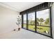 Bedroom featuring a picturesque view and lots of natural light at 50 Coe Rd # 224, Belleair, FL 33756