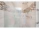 Walk-in shower with grab bars and updated tile work at 50 Coe Rd # 224, Belleair, FL 33756