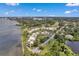 Aerial view of waterfront condo community with pool and golf course at 50 Coe Rd # 224, Belleair, FL 33756