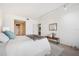 Serene bedroom with a comfortable bed and access to the bathroom at 50 Coe Rd # 224, Belleair, FL 33756