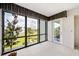 Sunroom with serene water views and ample natural light at 50 Coe Rd # 224, Belleair, FL 33756