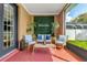 Relaxing screened porch with seating area, perfect for outdoor enjoyment at 11302 Southwind Lake Dr, Gibsonton, FL 33534