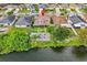 House on the lake with a backyard fire pit and patio at 11302 Southwind Lake Dr, Gibsonton, FL 33534