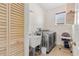 Laundry room with washer, dryer, utility sink and storage at 11302 Southwind Lake Dr, Gibsonton, FL 33534