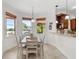 Bright dining area with water views and a table for six at 11302 Southwind Lake Dr, Gibsonton, FL 33534