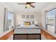 Bright bedroom with a queen bed and hardwood floors at 11302 Southwind Lake Dr, Gibsonton, FL 33534