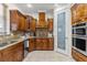 Kitchen boasts wood cabinetry, granite counters, and a pantry at 11302 Southwind Lake Dr, Gibsonton, FL 33534
