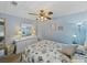 Bedroom with seashell bedding and dresser at 35027 Wagner Way, Zephyrhills, FL 33541