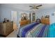 Bright bedroom with large bed and dresser at 35027 Wagner Way, Zephyrhills, FL 33541
