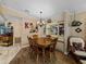 Charming dining room with a wood table, chandelier, and built-in hutch at 35027 Wagner Way, Zephyrhills, FL 33541