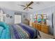 Spacious bedroom with a ceiling fan and dresser at 35027 Wagner Way, Zephyrhills, FL 33541