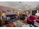 Living room with striped wall and comfortable seating at 35027 Wagner Way, Zephyrhills, FL 33541