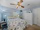 Bedroom with white dresser and ceiling fan at 35027 Wagner Way, Zephyrhills, FL 33541