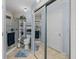 Bathroom with shower, toilet and shelving at 35027 Wagner Way, Zephyrhills, FL 33541