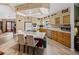 Island kitchen with light wood cabinets and modern appliances at 35027 Wagner Way, Zephyrhills, FL 33541