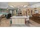 Open floor plan combining kitchen and dining area with island and breakfast bar at 35027 Wagner Way, Zephyrhills, FL 33541