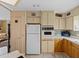 Clean and functional kitchen with white appliances and wood cabinets at 35027 Wagner Way, Zephyrhills, FL 33541