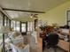Sunroom with a workspace, comfortable seating, and plenty of natural light at 35027 Wagner Way, Zephyrhills, FL 33541