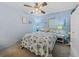 Bedroom with coastal bedding and ceiling fan at 35027 Wagner Way, Zephyrhills, FL 33541