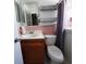 Bathroom with pink tile, vanity, toilet and walk-in shower at 10011 40Th N St # 3, Pinellas Park, FL 33782