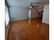 Spacious living room with laminate wood flooring and a ceiling fan at 10011 40Th N St # 3, Pinellas Park, FL 33782