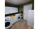 Laundry room with washer, dryer, cabinets, and sink at 10011 40Th N St # 3, Pinellas Park, FL 33782