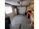 Garage with overhead door, workbench and storage at 10011 40Th N St # 3, Pinellas Park, FL 33782