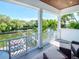 Covered balcony with water views and comfortable seating at 4923 W Melrose N Ave, Tampa, FL 33629