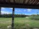 View of the backyard from under the house's construction at 8100 Spring Forest Ln, Wesley Chapel, FL 33544
