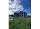 Home under construction, showcasing exterior features at 8100 Spring Forest Ln, Wesley Chapel, FL 33544