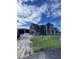 Home under construction, showcasing exterior features and landscaping at 8100 Spring Forest Ln, Wesley Chapel, FL 33544