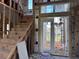Interior view of home under construction, showing staircase and front entry at 8100 Spring Forest Ln, Wesley Chapel, FL 33544