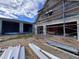 Exterior view of a house under construction, showing blockwork and scaffolding at 8100 Spring Forest Ln, Wesley Chapel, FL 33544