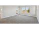 Bedroom featuring carpet flooring, white walls, and natural light at 12977 Long Valley Cir, Spring Hill, FL 34609