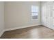 Bedroom with laminate flooring, a double door closet, and natural light at 12977 Long Valley Cir, Spring Hill, FL 34609