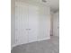 Bedroom with carpet flooring and double door closet at 12977 Long Valley Cir, Spring Hill, FL 34609