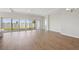 Bright, open living space with modern flooring and sliding glass doors leading to the backyard at 12977 Long Valley Cir, Spring Hill, FL 34609