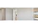 A living room with a white door and a view of the outside at 12977 Long Valley Cir, Spring Hill, FL 34609