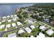 An aerial view of manufactured homes near a lake and RV/boat storage at 15 Hamilton Ln # 7, Palm Harbor, FL 34684