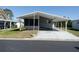 Charming single-story home featuring a covered carport and well-kept landscaping at 34045 Brown Bayou, Wesley Chapel, FL 33543