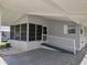 Close-up of a single-story home featuring a convenient ramp and covered carport at 34045 Brown Bayou, Wesley Chapel, FL 33543